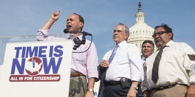 UNITED STATES - APRIL 10: From left, Rep. Luis Gutierrez, D-Ill., speaks to immigration reform supporters as Rep. Ruben Hinojosa, D-Texas, and Rep. Raul Grijalva, D-Ariz., listen during the National Rally for Citizenship on the west lawn of the U.S. Capitol on Wednesday, April 10, 2013. (Photo by Bill Clark/Getty Images)