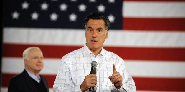 SALEM, NH - JANUARY 05: Republican presidential candidate, former Massachusetts Governor Mitt Romney answers audience member's questions during a campaign town hall meeting at the Boys and Girls Club January 5, 2012 in Salem, New Hampshire. Sen. John McCain (R-AZ), the GOP presidential nominee who ran against President Barack Obama in 2008, endorsed Romney on Wednesday. Romney eked out an eight-vote victory in the Iowa Caucuses against former U.S. Senator Rick Santorum, who is also stumping in New Hampshire. (Photo by Charles Ommanney/Getty Images) 