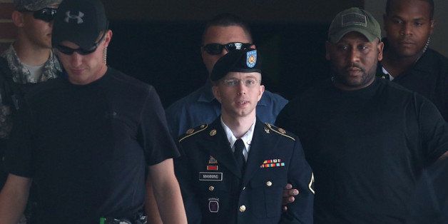 FORT MEADE, MD - JULY 30: U.S. Army Private First Class Bradley Manning is escorted by military police as he leaves his military trial after he was found guilty of 20 out of 21 charges, July 30, 2013 at Fort George G. Meade, Maryland. Manning, was found not guilty of aiding the enemy, was convicted of wrongfully causing intelligence to be published on the internet, is accused of sending hundreds of thousands of classified Iraq and Afghanistan war logs and more than 250,000 diplomatic cables to the website WikiLeaks while he was working as an intelligence analyst in Baghdad in 2009 and 2010. (Photo by Mark Wilson/Getty Images)