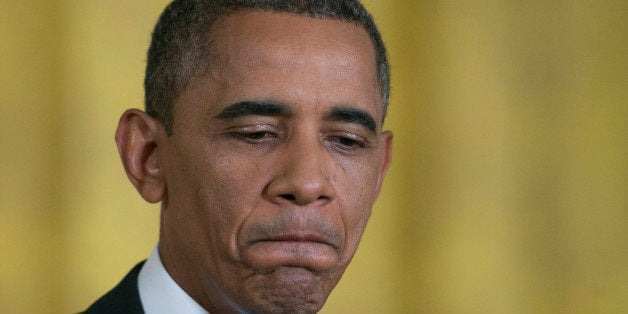 U.S. President Barack Obama pauses while speaking during a news conference in the East Room of the White House in Washington, D.C., U.S., on Friday, Aug. 9, 2013. Obama said he'll seek changes to the Patriot Act and appoint a panel of outside experts to assess ways to give U.S. citizens uneasy over government surveillance programs confidence that their civil liberties are protected. Photographer: Andrew Harrer/Bloomberg via Getty Images