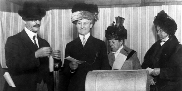 Three unidentified women make history by becoming the first of their sex to vote in an election after the 19th Amendment was passed, San Francisco, California, late 1910s or early 1920s. (Photo by Underwood Archives/Getty Images)