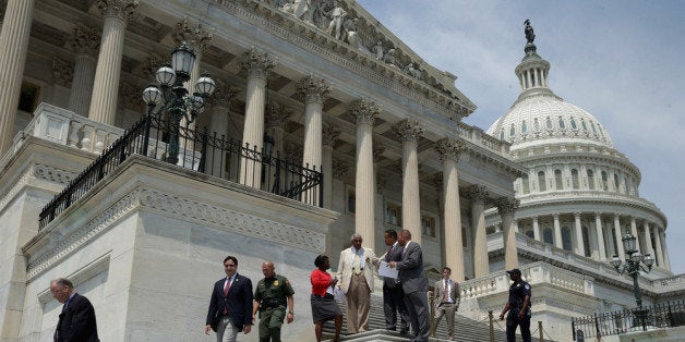 WASHINGTON, DC - AUGUST 02: Members of the House of Representativs leave the U.S. Capitol as Congress begins its summer recess August 2, 2013 in Washington, DC. Congress is headed into its summer recess without a deal on a federal budget, paving the way for a big showdown between Republicans and Democrats and a possible government shutdown in September. (Photo by Chip Somodevilla/Getty Images)