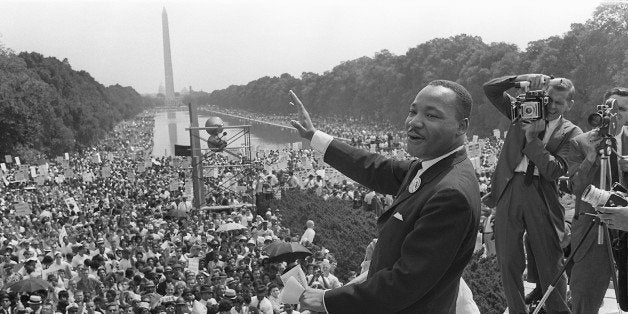 WASHINGTON, UNITED STATES: The civil rights leader Martin Luther KIng (C) waves to supporters 28 August 1963 on the Mall in Washington DC (Washington Monument in background) during the 'March on Washington'. King said the march was 'the greatest demonstration of freedom in the history of the United States.' Martin Luther King was assassinated on 04 April 1968 in Memphis, Tennessee. James Earl Ray confessed to shooting King and was sentenced to 99 years in prison. King's killing sent shock waves through American society at the time, and is still regarded as a landmark event in recent US history. (Photo credit should read AFP/AFP/Getty Images)