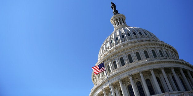 WASHINGTON, DC - FEBRUARY 12: A U.S. flag flies in front of the dome of the U.S. Capitol February 12, 2013 on Capitol Hill in Washington, DC. U.S. President Barack Obama will give his annual State of the Union address this evening during a joint session of the Congress. (Photo by Alex Wong/Getty Images)