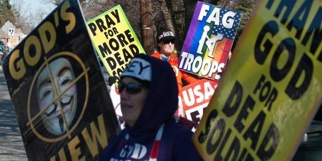 Shirley Phelps-Roper (front) and her daughter Megan of the Westboro Baptist Church, a Kansas church known for its vehement anti-gay positions and for protesting at US soldiers' funeral, stage a protest across the street from Northwestern High School in Hyattsville, Maryland, outside Washington, on March 1, 2011. The church was demonstrating against what it claims is a 'pervert-run' school and said teachers across the country have 'broken the moral compass of this generation.' AFP PHOTO/Nicholas KAMM (Photo credit should read NICHOLAS KAMM/AFP/Getty Images)