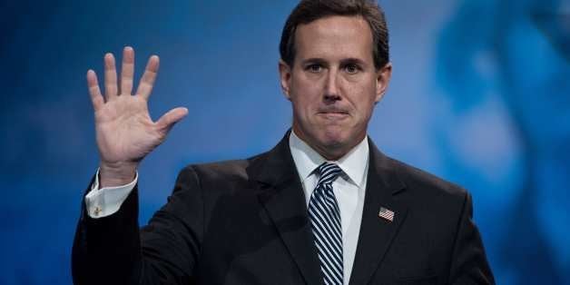 Former US Republican Senator from Pennsylvania Rick Santorum waves after speaking at the Conservative Political Action Confer