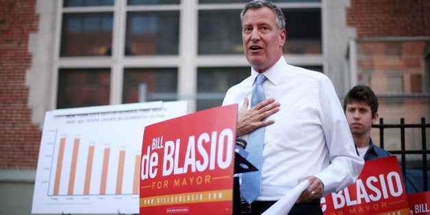 NEW YORK, NY - AUGUST 15: New York City Public Advocate and Democratic mayoral candidate Bill de Blasio speaks at a press conference outside the East Side Community High School on August 15, 2013 in New York City. De Blasio spoke about his plan to tax the wealthy in order to expand city's after-school programs. A Quinnipiac poll released August 13 shows de Blasio now leading in the Democratic primary race for mayor. (Photo by Mario Tama/Getty Images)