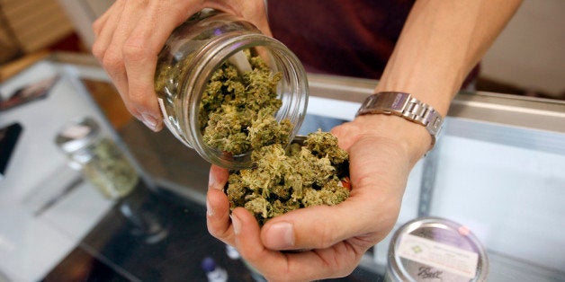 LOS ANGELES, CA - JULY 25: A budtender pours marijuana from a jar at Perennial Holistic Wellness Center medical marijuana dispensary, which opened in 2006, on July 25, 2012 in Los Angeles, California. The Los Angeles City Council has unanimously voted to ban storefront medical marijuana dispensaries and to order them to close or face legal action. The council also voted to instruct staff to draw up a separate ordinance for consideration in about three months that might allow dispensaries that existed before a 2007 moratorium on new dispensaries to continue to operate. It is estimated that Los Angeles has about one thousand such facilities. The ban does not prevent patients or cooperatives of two or three people to grow their own in small amounts. Californians voted to legalize medical cannabis use in 1996, clashing with federal drug laws. The state Supreme Court is expected to consider ruling on whether cities can regulate and ban dispensaries. (Photo by David McNew/Getty Images)