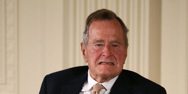 WASHINGTON, DC - JULY 15: Former President George H. W. Bush sits in a wheelchair during an event in the East Room at the Wh