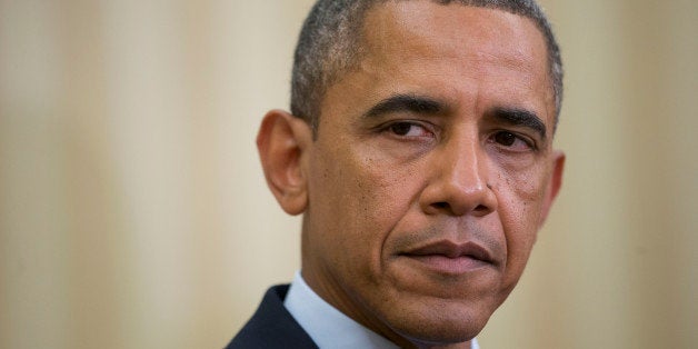 U.S. President Barack Obama listens as Abdurabu Mansur Hadi, Yemen's president, not pictured, speaks in the Oval Office of the White House in Washington, D.C., U.S., on Thursday, Aug. 1, 2013. The White House meeting marks the second between Obama and Hadi, who took office in February 2012 and has cooperated on counter-terrorism with the U.S. Photographer: Andrew Harrer/Bloomberg via Getty Images 