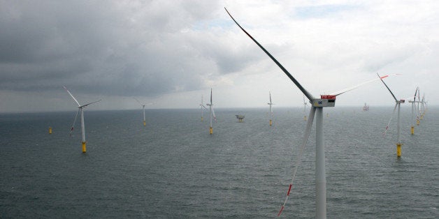 BORKUM, GERMANY - JUNE 23: Wind turbines stand at the nearly completed Riffgat offshore wind farm in the North Sea on June 23, 2013 near Borkum, Germany in front of the jack-up installation vessel 'Bold Tern'. The Riffgat facility includes 30 turbines with a capacity of 3.6 megawatts each for a total output of 108 megawatts, enough to provide power to 120,000 households. Germany is pursuing the construction of offshore wind farms in the North Sea as well as the Baltic Sea, though some projects have been hampered by a lack of adequate undersea cables to bring the power on shore. (Photo by David Hecker/Getty Images)