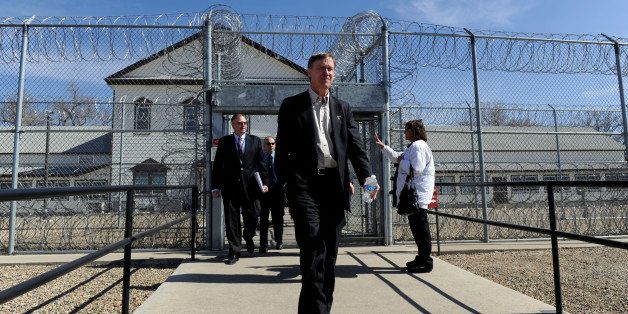 LAS ANIMAS, CO--Colorado Governor, John Hickenlooper, center, exits the Fort Lyon Correctional Facility in Las Animas Colorado Wednesday afternoon after taking a tour. Hickenlooper has proposed to close the facility due to budget concerns and on Wednesday, toured the facility and spoke with prison officials and employees. Andy Cross, The Denver Post (Photo By Andy Cross/The Denver Post via Getty Images)