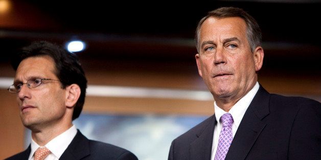 House Speaker John Boehner, a Republican from Ohio, right, and House Majority Leader Eric Cantor, a Republican from Virginia, listen during a press conference in Washington, D.C., U.S., on Thursday, July 14, 2011. Boehner said he's glad Cantor is involved in deficit-cutting talks, following Democratic criticism that Cantor is hindering progress. Photographer: Joshua Roberts/Bloomberg via Getty Images 