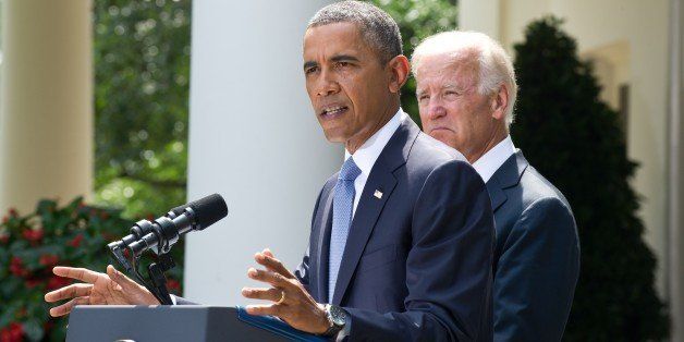 US President Barack Obama, with US Vice President Joe Biden, speaks on Syria in the Rose Garden at the White House in Washington on August 31, 2013. Obama said Saturday he will ask the US Congress to authorize military action against Syria, lifting the threat of immediate strikes on President Bashar al-Assad's regime. Obama said he had decided he would go ahead and launch military action on Syria, but he believed it was important for American democracy to win the support of lawmakers. AFP PHOTO/Nicholas KAMM (Photo credit should read NICHOLAS KAMM/AFP/Getty Images)