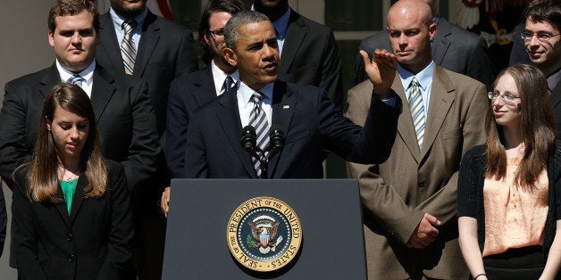 WASHINGTON, DC - MAY 31: U.S. President Barack Obama, surrounded by college students, makes a statement on student loans in the Rose Garden of the White House May 31, 2013 in Washington, DC. Obama made existing student loan programs an issue during his campaign last year while visiting many college campuses across the U.S.. (Photo by Win McNamee/Getty Images)