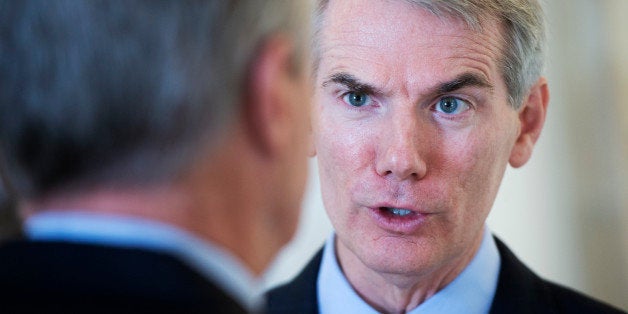 UNITED STATES - AUGUST 01: Sens. Rob Portman, R-Ohio, right, and Max Baucus, D-Mont., talk in Russell Building before for a bipartisan luncheon. (Photo By Tom Williams/CQ Roll Call)