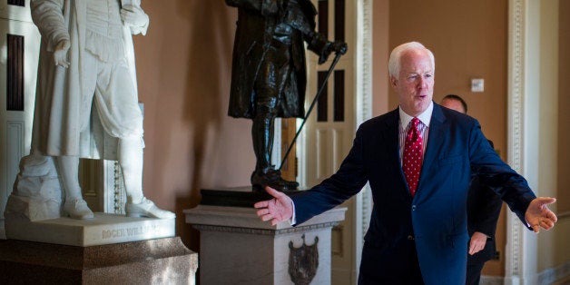 UNITED STATES - JULY 15: Sen. John Cornyn, R-Texas, walks from Senate Minority Leader McConnell's office to the Senate floor for the attendance vote prior to the all-Senate Joint Conference on the filibuster on Monday, July 15, 2013. (Photo By Bill Clark/CQ Roll Call)