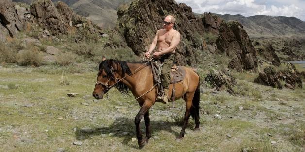 Russian Prime Minister Vladimir Putin rides a horse during his vacation outside the town of Kyzyl in Southern Siberia on August 3, 2009. AFP PHOTO / RIA-NOVOSTI / ALEXEY DRUZHININ (Photo credit should read ALEXEY DRUZHININ/AFP/Getty Images)