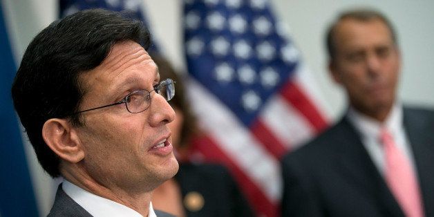 WASHINGTON, DC - JUNE 12: Rep. Eric Cantor (R-VA) (L) answers questions as Speaker of the House John Boehner (R-OH) (R) listens during a press availability at the U.S. Capitol June 12, 2013 in Washington, DC. Members of the House Republican leadership met with reporters following their weekly Republican Conference meeting. (Photo by Win McNamee/Getty Images)