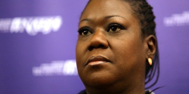 The mother of Trayvon Martin, Sybrina Fulton, listens to a question during a news conference at the National Association of B