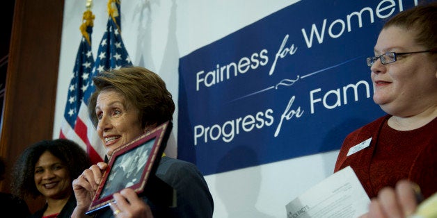 UNITED STATES - June 6 : House Minority Leader Nancy Pelosi, D-CA., shows a photo of President Kennedy with her family in Baltimore after he passed the equal pay act during a press conference on the 50th anniversary of the equal pay act in the Cannon House Office Building on June 6, 2013. (Photo By Douglas Graham/CQ Roll Call)