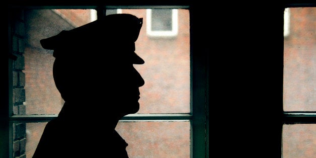 Silhouette of a prison/police warden