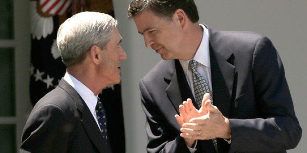 WASHINGTON, DC - JUNE 21: U.S. President Barack Obama (R) and FBI Director nominee James Comey (C) applaud while commending outgoing FBI Director Robert Mueller (L) during a ceremony announcing Comey's nomination in the Rose Garden of the White House June 21, 2013 in Washington, DC. Comey is a former Justice Department official in the administration of former U.S. President George W. Bush. (Photo by Win McNamee/Getty Images)