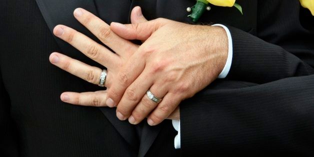 Hands of Gay Couple with Wedding Rings