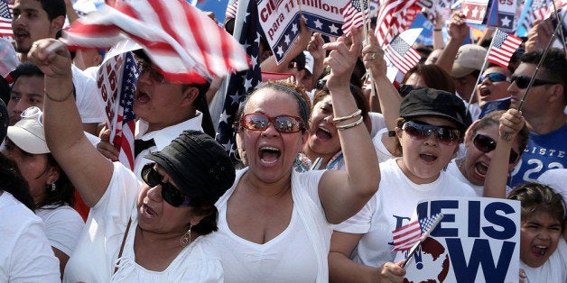 WASHINGTON, DC - APRIL 10: Immigration activists cheer on the West Lawn of the U.S. Capitol at an All In for Citizenship rally April 10, 2013 on Capitol Hill in Washington, DC. Tens of thousands of reform supporters gathered for the rally to call on Congress to act on proposals that would grant a path to citizenship for an estimated 11 million of the nation's illegal immigrants. (Photo by Alex Wong/Getty Images)