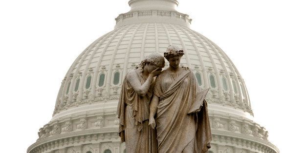 The Peace Monument, with the representation of Grief weeping on the shoulder of History, stands in front of the he U.S. Capitol in Washington, D.C., U.S., on Monday, Nov. 21, 2011. A debt-reduction committee with special powers that was supposed to dissolve congressional gridlock in Washington is instead on the brink of failure, setting the stage for $1.2 trillion in automatic spending cuts. Photographer: Joshua Roberts/Bloomberg via Getty Images