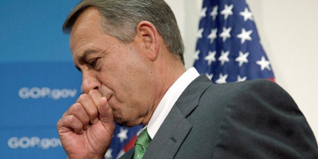 WASHINGTON, DC - SEPTEMBER 26: U.S. Speaker of the House John Boehner listens to House Republican colleagues speak at a pres