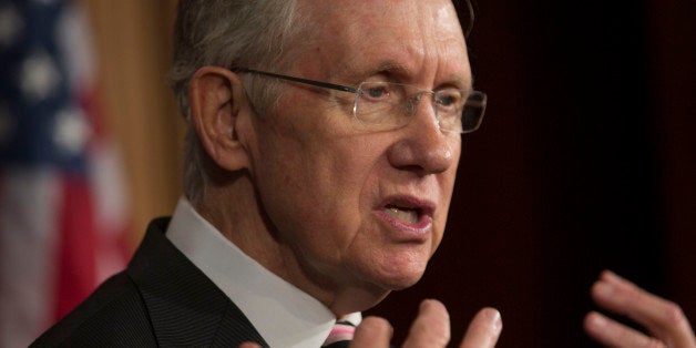 Senator Harry Reid, a Democrat from Nevada and Senate majority leader, speaks during a news conference following a vote in Washington, D.C., U.S., on Friday, Sept. 27, 2013. The U.S. Senate voted to finance the government through Nov. 15 after removing language to choke off funding for the health care law, putting pressure on the House to avoid a federal shutdown set to start Oct. 1. Photographer: Andrew Harrer/Bloomberg via Getty Images 