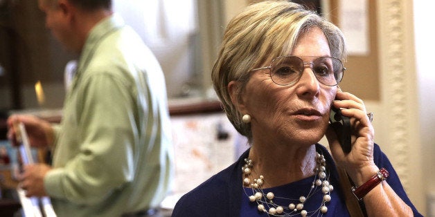 WASHINGTON, DC - JUNE 12: U.S. Sen. Barbara Boxer (D-CA) talks on her cellular phone prior to a news conference June 12, 2013 on Capitol Hill in Washington, DC. Boxer and McDermott held a news conference to announce that they are introducing a bill to block congressional pay if lawmakers fail to raise the debt ceiling. (Photo by Alex Wong/Getty Images)