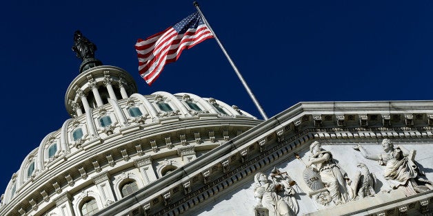 WASHINGTON, DC - SEPTEMBER 29: An American flag waves outside the United States Capitol building as Congress remains gridloc