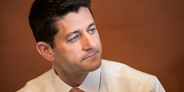 Rep. Paul Ryan (R-WI) listens while speaking to the press with other House Republican conferees on Capitol Hill October 1, 20