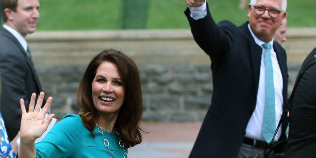 WASHINGTON, DC - JUNE 19: Rep. Michele Bachmann (R-MN) and Glenn Beck wave to supporters at a Tea Party rally in front of the U.S. Capitol, June 17, 2013 in Washington, DC. The group Tea Party Patriots hosted the rally to protest against the Internal Revenue Service's targeting Tea Party and grassroots organizations for harassment. (Photo by Mark Wilson/Getty Images)