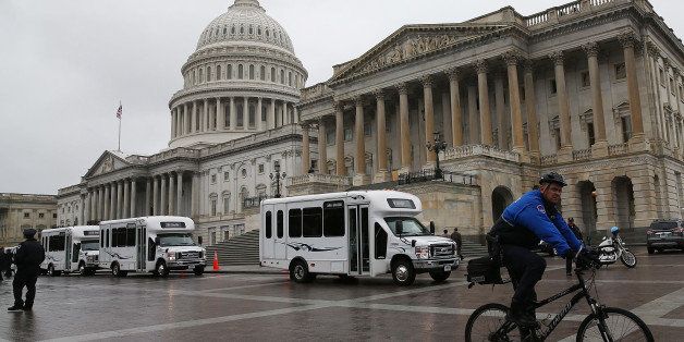WASHINGTON, DC - OCTOBER 10: Senate Democrats ride in buses as they depart the Capitol for a meeting with U.S. President Barack Obama October 9, 2013 in Washington, DC. The U.S. government shutdown is entering its tenth day as the U.S. Senate and House of Representatives remain gridlocked on funding the federal government. (Photo by Mark Wilson/Getty Images)