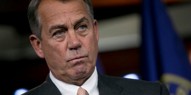 House Speaker John Boehner, a Republican from Ohio, listens to a question during a news conference in Washington, D.C., U.S., on Thursday, Sept. 12, 2013. House Republican leaders are struggling to avoid a U.S. government shutdown at month's end after delaying a vote on a spending plan opposed by dozens of their caucus members. Photographer: Andrew Harrer/Bloomberg via Getty Images 