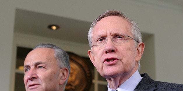 US Senate Majority Leader Harry Reid, D-NV, (R) briefs journalists following a meeting with US President Barack Obama outside the West Wing of the White House in Washington, DC, on October 10, 2013. Obama confronts Republican leaders on October 10, just one week before a political stalemate could take an even more extreme turn and degenerate into a historic debt default crisis. House Republican leaders, including Speaker John Boehner, will join Obama at the White House, with neither side yet apparently ready to concede ground in a standoff over a government shutdown and raising America's borrowing authority. AFP Photo/Jewel Samad (Photo credit should read JEWEL SAMAD/AFP/Getty Images)