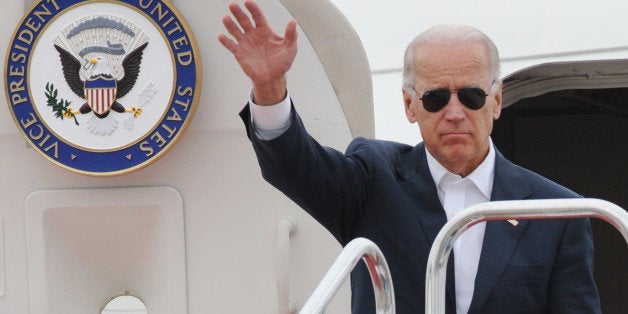 US Vice President Joe Biden waves as he arrives at Sendai airport in Natori, Miyagi prefecture on August 23, 2011 nearly six