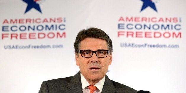 Texas Governor Rick Perry responds to questions during a press conference on the sidelines of the Republican Party's State Pa