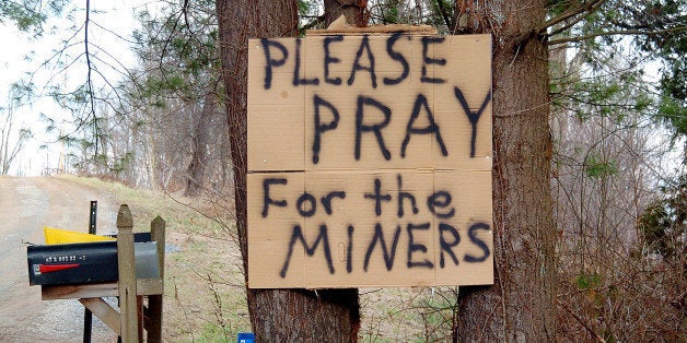 UNITED STATES - JANUARY 09: A handwritten sign posted on trees in Tallmansville, W.Va., asks people to pray for the 12 coal miners who died after an explosion in the Sago Mine left them trapped for more than 42 hours. (Photo by Debbie Egan-Chin/NY Daily News Archive via Getty Images)