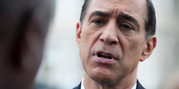 UNITED STATES - Oct 9: Rep. Darrell Issa, R-CA., talks with residents of Washington, D.C. before the start of a press conference in the Senate Swamp on October 9, 2013 on the DC budget during government shutdown. (Photo By Douglas Graham/CQ Roll Call)