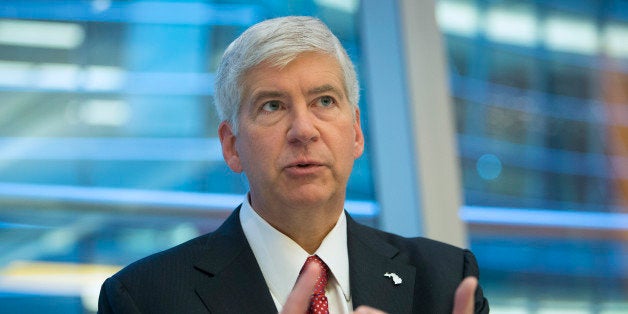 Rick Snyder, governor of Michigan, speaks during an interview in New York, U.S., on Friday, July 26, 2013. Snyder said he hopes to 'get through' the Detroit bankruptcy filing by 'the fall of next year.' Photographer: Scott Eells/Bloomberg via Getty Images 