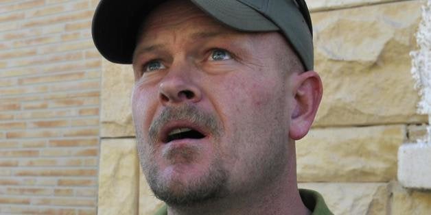 Samuel Joseph Wurzelbacher, or 'Joe the Plumber', looks at a building hit by a rocket launched by Gaza Strip militants in the coastal Israeli city of Ashkelon on January 12, 2009. Joe the Plumber?, is morphing into 'Joe the War Correspondent'. He traveled to Israel to report for US conservative website pjtv.com, giving the perspective of ordinary Israelis on the conflict in Gaza. AFP PHOTO/DAVID BUIMOVITCH (Photo credit should read DAVID BUIMOVITCH/AFP/Getty Images)