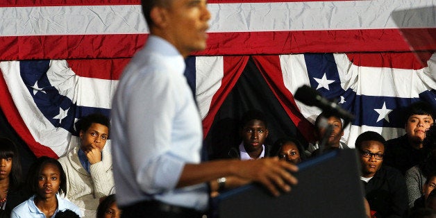 NEW YORK, NY - OCTOBER 25: Students watch as U.S. President Barack Obama speaks at the Pathways in Technology Early College High School in the Crown Heights section of Brooklyn on October 25, 2013 in New York City. President Obama had mentioned the school in a part of Brooklyn that's struggled with poverty and violence during his State of the Union address in February. While in New York Obama will also attend events to raise money for the Democratic National Committee and Democratic Congressional Campaign Committee. (Photo by Spencer Platt/Getty Images)