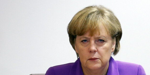 German Chancellor Angela Merkel attends a meeting entitled 'Cut EU Red Tape' during the European Union Summit of Heads of States held at the European Union Council building in Brussels on October 25, 2013. European leaders said Friday they want a new deal with Washington to end a damaging spy row so as to keep an essential alliance and the fight against terrorism on track. AFP PHOTO / POOL - YVES HERMAN (Photo credit should read YVES HERMAN/AFP/Getty Images)