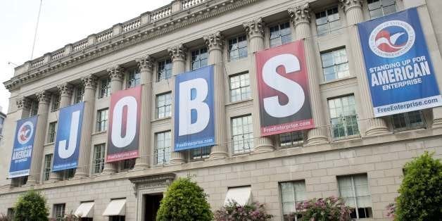 A Jobs sign is seen on the US Chamber of Commerce Building in Washington, DC, on August 2, 2013. The US unemployment rate fell to a four-year low of 7.4 percent in July as the economy added 162,000 jobs, the Labor Department said Friday in a weaker-than-expected report. AFP PHOTO / Saul LOEB (Photo credit should read SAUL LOEB/AFP/Getty Images)