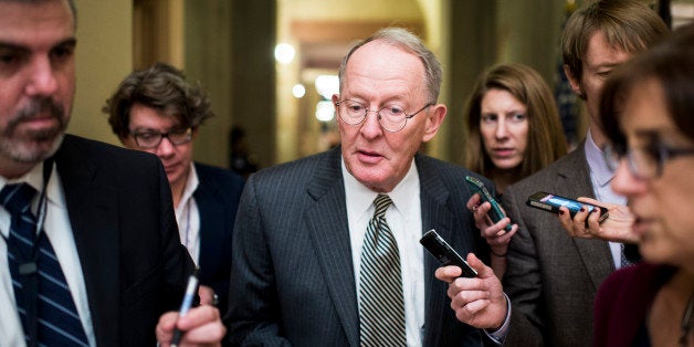 UNITED STATES - OCTOBER 10: Sen. Lamar Alexander, R-Tenn., speaks with reporters as he leaves a Senate Republican caucus meeting in the Capitol on Thursday, Oct. 10, 2013. (Photo By Bill Clark/CQ Roll Call)