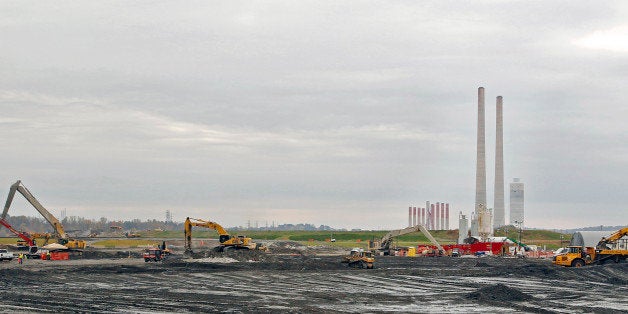 Machines work near the Tennessee Valley Authority Power Plant in Kingston, Tennessee, U.S., on Thursday, Oct. 27, 2011. In De